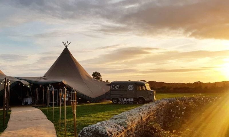 Nordic tipis at golden hour with a vintage Citroën van in a meadow — Paul Simon Marquees